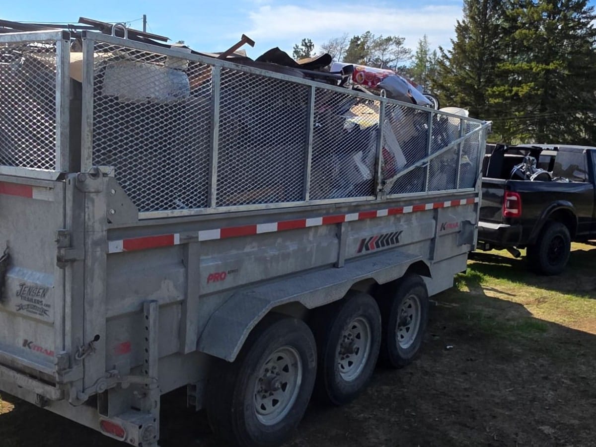 Trailer filled with furniture, household clutter and scrap metal after a Sudbury property cleanout by TCM Junk Removal